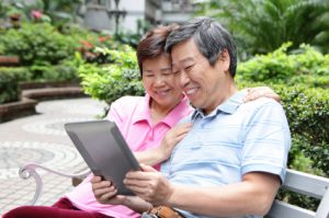 happy Senior couple using tablet pc